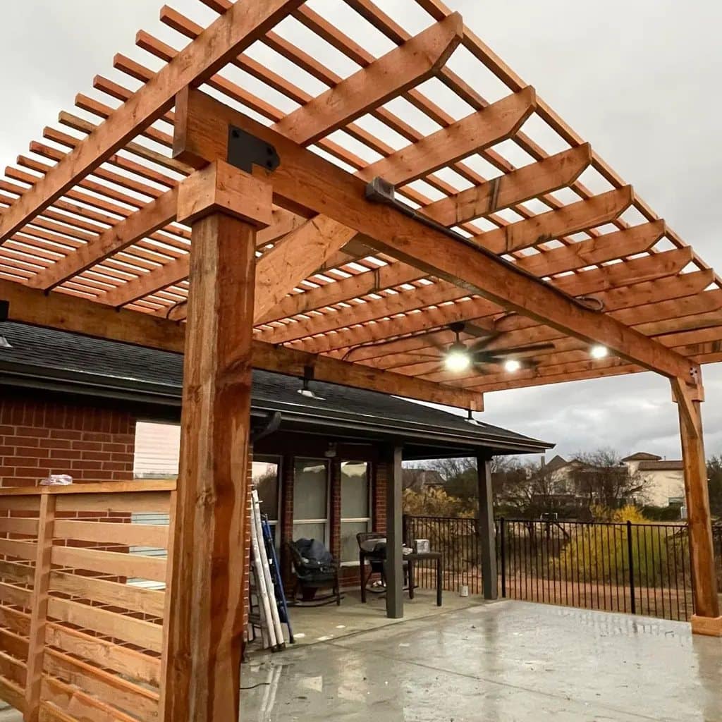 cedar pergola open slat rafters over concrete patio