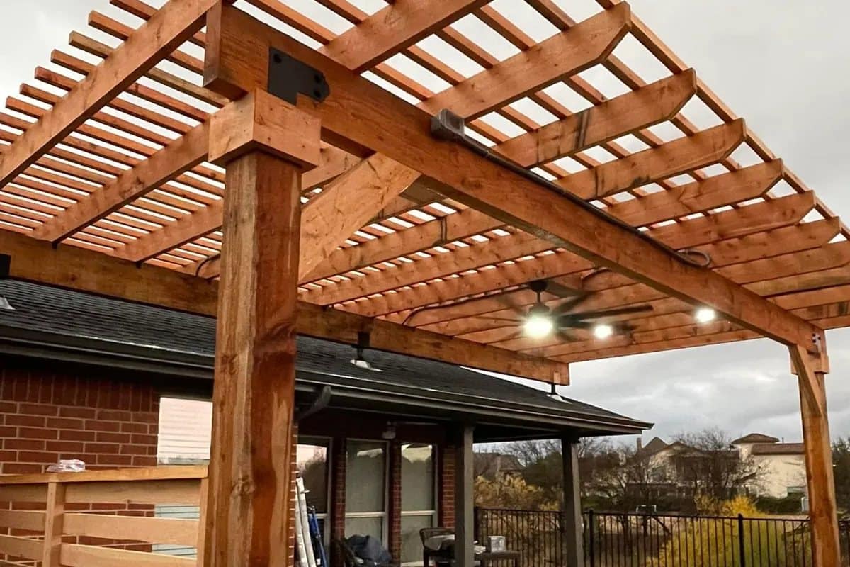 cedar pergola attached with horizontal screen wall