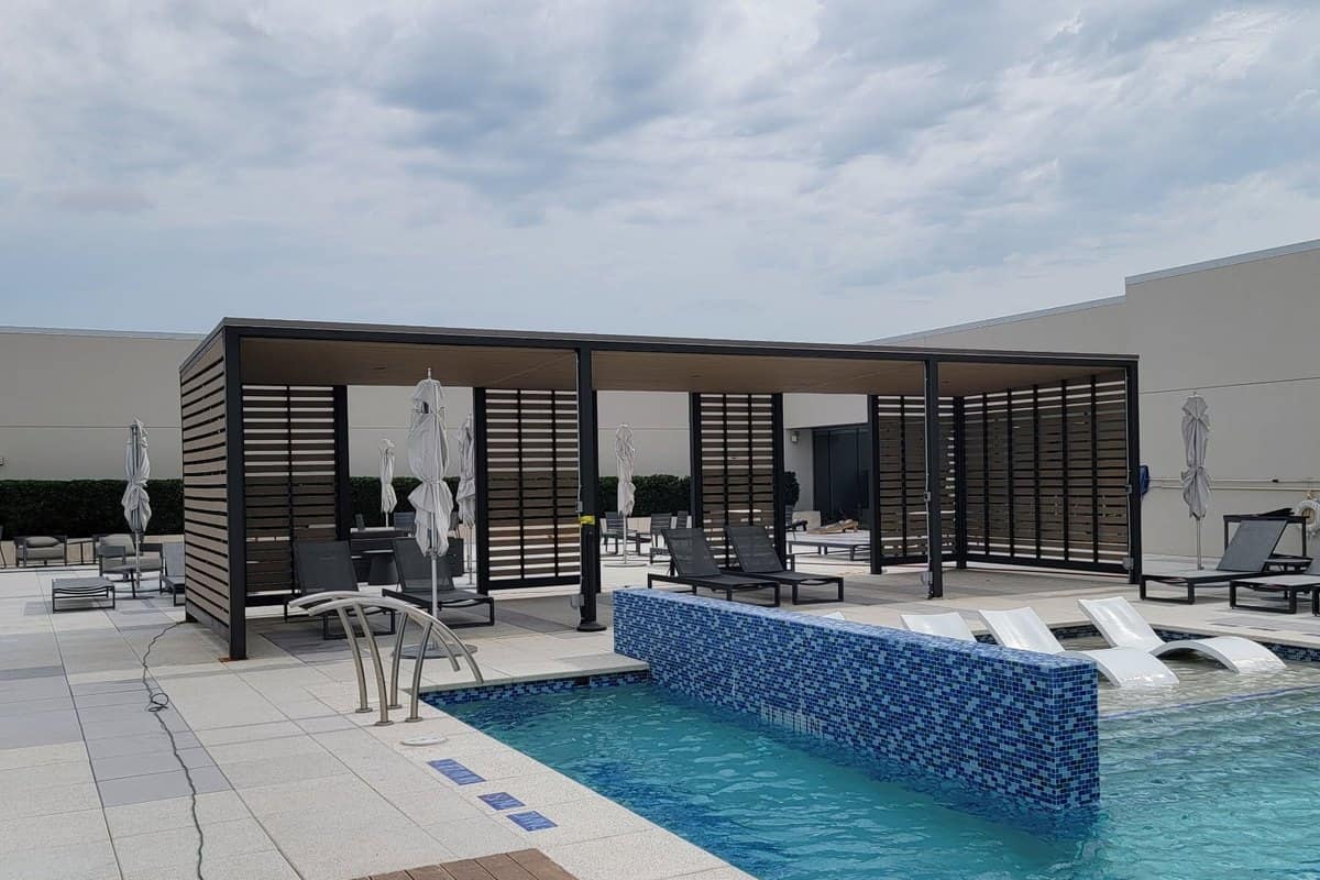 steel pergola cabana louvered screens poolside