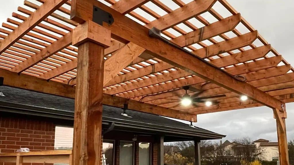 cedar pergola open slat rafters over concrete patio